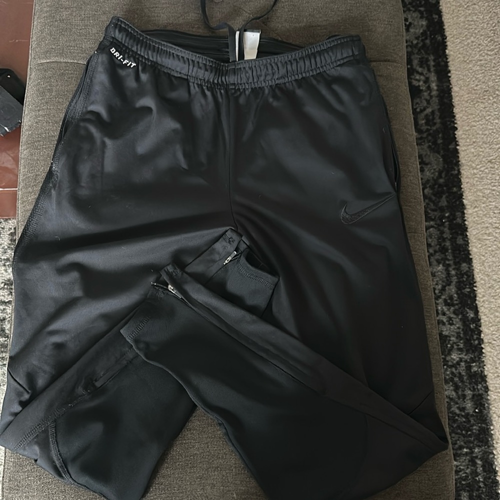 Nike running pants with zipper angles